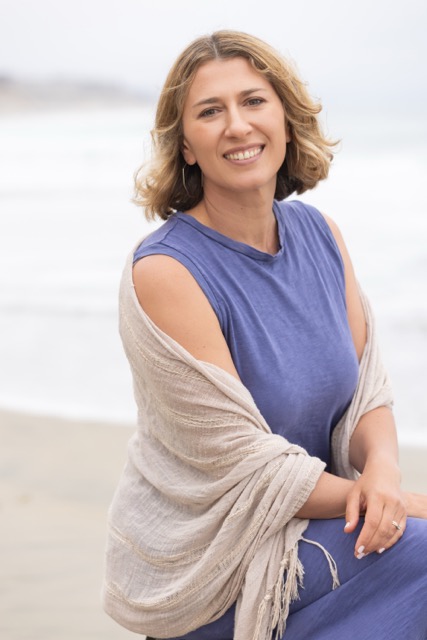 Vera McGrath sitting peacefully by the ocean